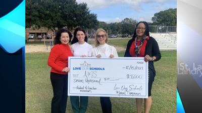 Love Our Schools & Manuel Companies Donate Spirit Shirts and a Surprise to Acadian Middle School