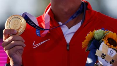 Mete Gazoz of Turkey celebrates with the gold medal during the medals ceremony.